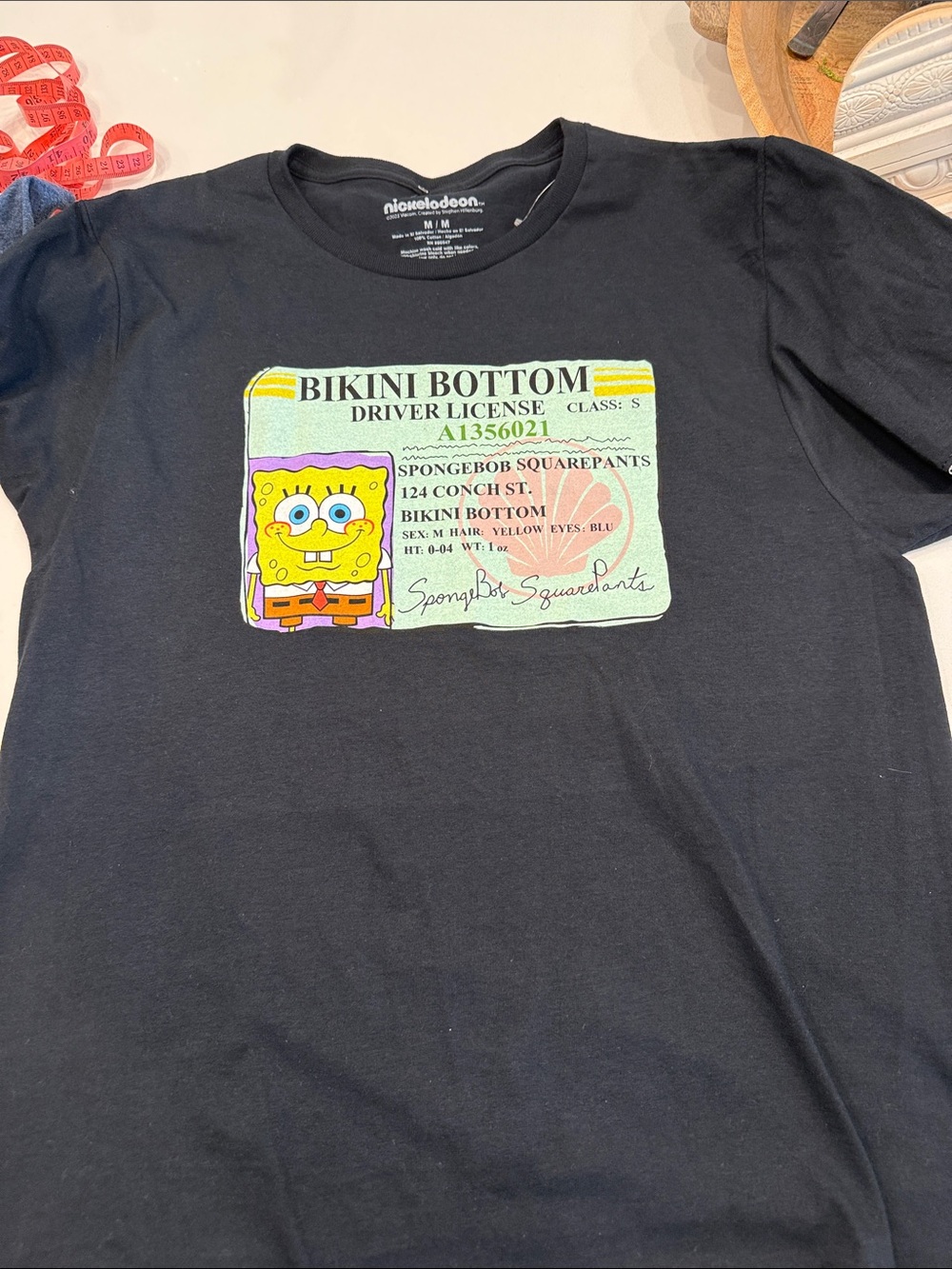Nickelodeon Black Tee with Yellow SpongeBob Bikini Bottom License Graphic